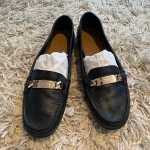Black leather Coach loafers